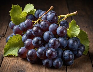Fototapeta premium Branch of blue wine grapes on a wooden table