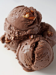 Decadent chocolate hazelnut ice cream, an image of decadent chocolate hazelnut ice cream, its rich brown color and chunks of hazelnut against a white backdrop, perfect for showcasing a classic