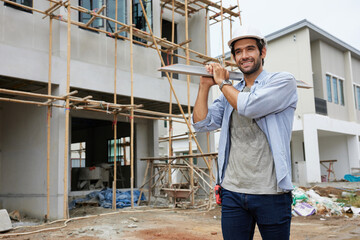 worker or architect holding a steel plank at construction site