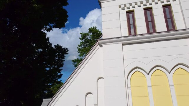 Drone flies around house, showing its architectural details.