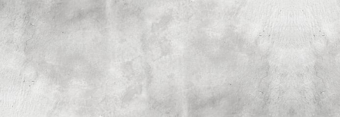 Fototapeta premium Large white grunge textured concrete wall background. The backdrop is a rough cement floor in gray and white tones.