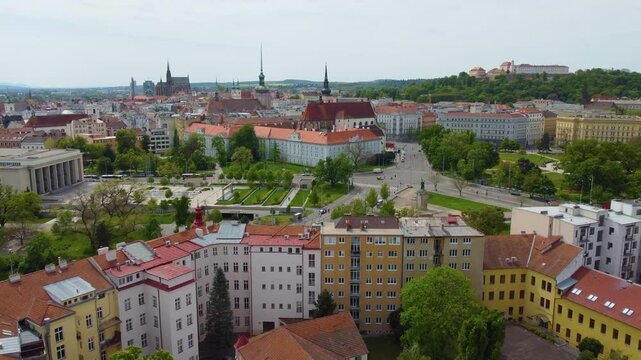 Drone push in, city skyline of Brno, Czech Republic, its buildings, architecture and roads.