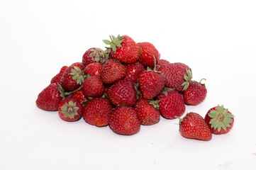 Strawberries on a white background. Strawberry close-up isolated. Juicy berries picked for dessert.