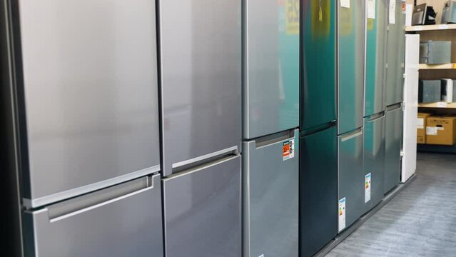 Rows of fridges in household appliance store
