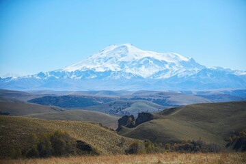 A natural mountain landscape. The highest peaks of the Caucasian ridge and Mount Elbrus, 5642 meters.