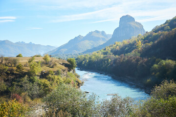 A natural mountain landscape. Mountain peaks and the Kuban River, Karachayevsk, Russia