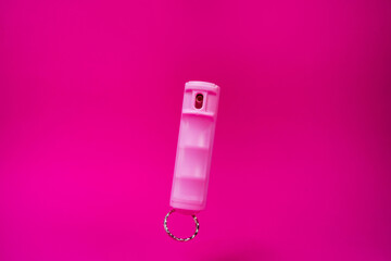 Pink pepper spray keyring in pink background