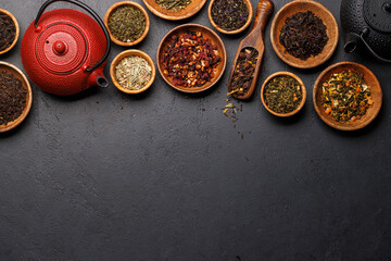 A collection of various teas nestled in wooden bowls