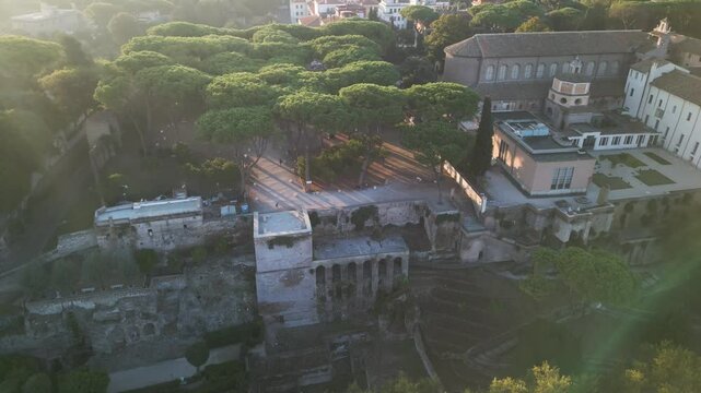 Aerial parallax over scenic historic brick building overlook and tree garden in the Orange Garden Italy