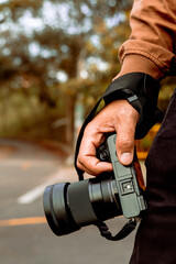 Long-haired, bearded Latino man in a brown jacket documenting his holiday and enjoying the golden hour in his country. World photography and travel day.