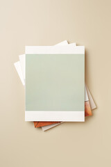 Stack of blank paper on beige background