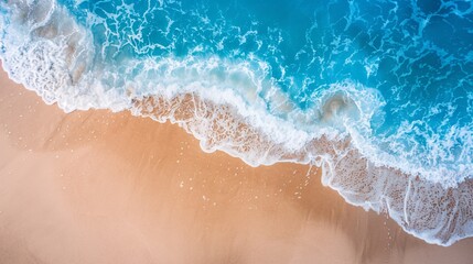 Aerial View of Blue Ocean Waves Crashing on Sandy Beach