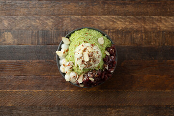 A top down view of a matcha bingsu bowl.