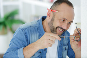 a middle aged man fitting a hock