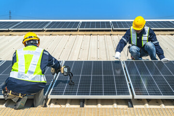 engineer man inspects construction of solar cell panel or photovoltaic cell by electronic device....