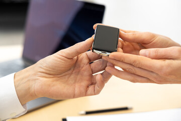 Close up picture of hands with passing the car keys