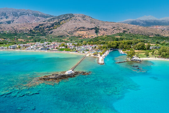 Aerial drone photo of famous chapel of Agios Nikolaos built at sea with a small path connecting to mainland, Georgioupoli, Chania, Crete island, Greece