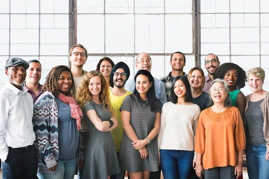 A team of diverse people doing a group photo