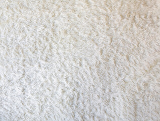 Soft, smooth white synthetic wool.