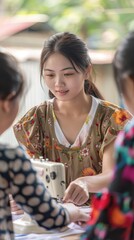 Fototapeta premium A young woman focuses intently on sewing with a sewing machine