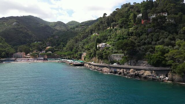 Europe, Italy, Liguria Drone aerial view of the amazing Beach of Paraggi in Santa Margherita and Portofino sea bay - Green water and summer time for tourist visiting attraction destination near Genoa