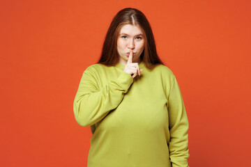 Young ginger chubby plus size woman wear green sweatshirt casual clothes say hush be quiet with...