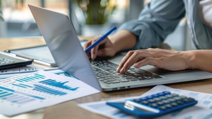 The hands typing on laptop
