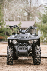 Fototapeta premium Powerful modern black all terrain vehicle for tourist's enjoyment