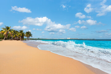 Paradise Sunny beach with palms and turquoise sea. Summer vacation and tropical beach concept - Cancun, Mexico