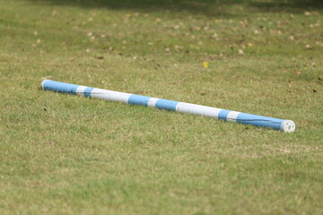  Horse obstacle course outdoors summertime. Poles in the sand for equestrian event