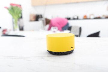 Close up photo of smart speaker able to manage home in wireless way	