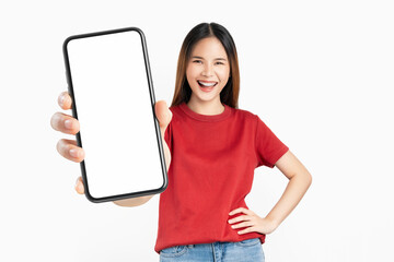 Beautiful Asian woman holding smartphone mockup of blank screen and smiling on white background.