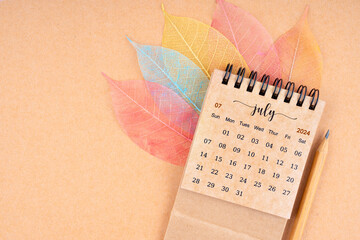 July 2024 monthly desk calendar and fiber structure of dry leaves texture, skeleton leaf.