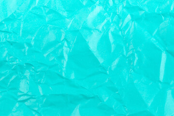 Blue color creased paper texture background.