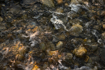 Water flowing over the rocks top view