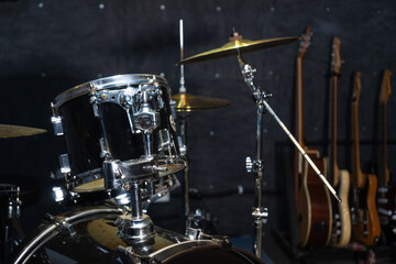 Part of a drum kit with cymbals in a music studio, on stage. Background for photos with live music,...