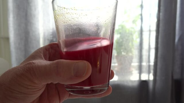 Stockholm, Sweden A man on a five-day fast drinks a blend of red beet juice and vegetable bouillon as part of his daily regimen. 