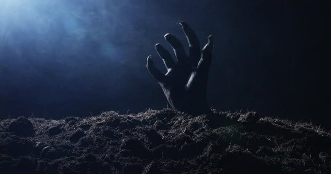 Zombie hand rising out from the ground
