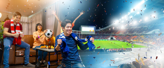 Group of Asian people friends sit on sofa watching and cheering football or soccer games competition on TV together at home.Happy man and woman sport fans celebrating sport team victory sports match