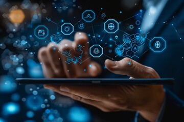 Businessman's hand holding an iPad with digital icons, futuristic technology concept