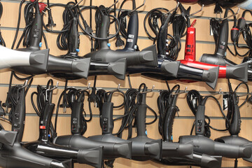 Many hair dryers in hairdresser shop