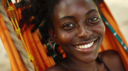 a close-up a young smiling african, american woman relax in hammock on beach