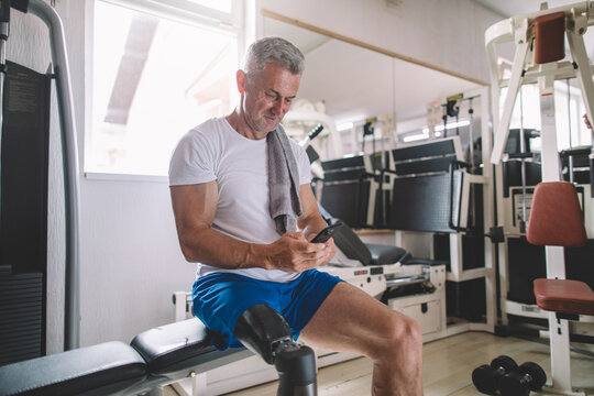 Inspiring veteran amputee using smartphone after workout