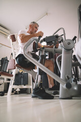 Veteran amputee athlete exercising in gym	