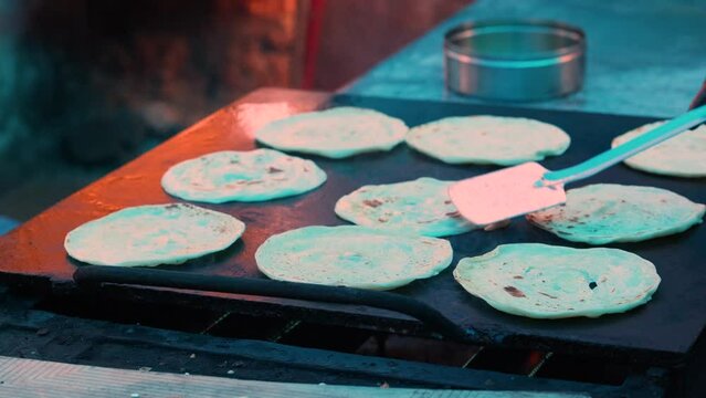 lachha paratha, closeup shot of Indian cuisine Garlic Paratha, multi layered fried flatbread selective focus video, layered flat bread over white cloth.