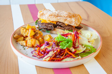 Roast beef ciabatta toasted sandwich lifestyle food in a cafe restaurant.