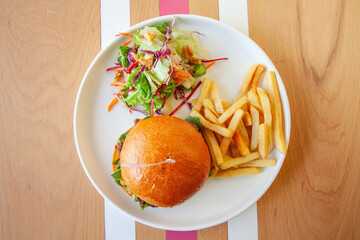 Smashed beef double patty brioche. In burger served with fries and empty label top aerial view. 