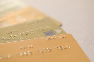 Many credit cards on gray background, closeup