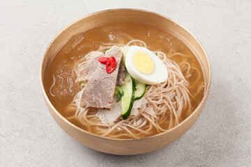 A food made by cutting cucumbers into small pieces, pickling them in salt or soy sauce, adding them to cold soup, and adding green onions, vinegar, sugar, and red pepper powder.