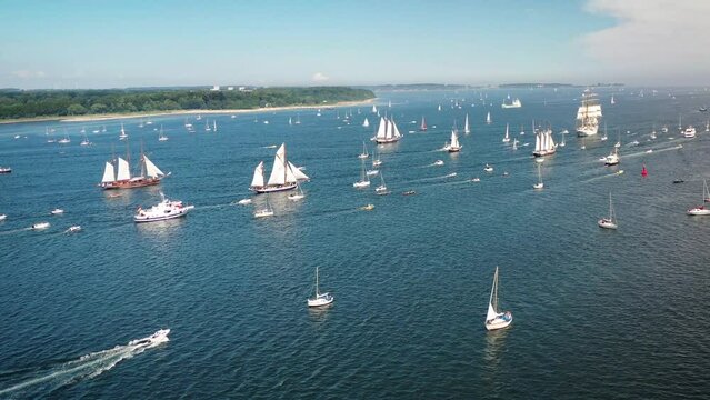 Tall ships passing Kieler F&ouml;rde to Kiel week. Parade of sailing ships during Kiel Week, Kiel Fjord, Schleswig-Holstein, Germany.
